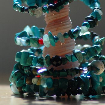 Muli-colored spiral around sea shell.
